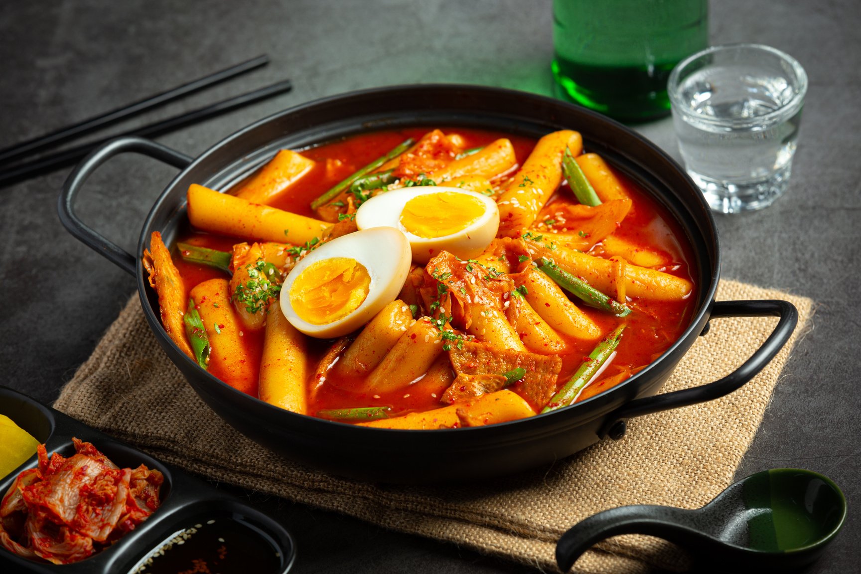 Cheesy Tokbokki korean traditional food on black board backg